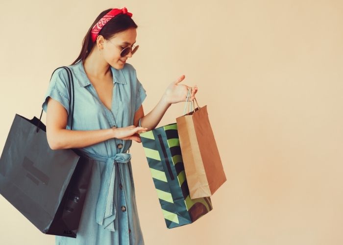 girl with shopping bags of her favorite brands